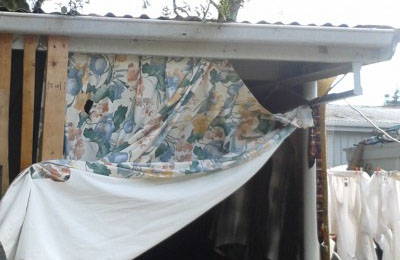 Mum with four year and two year-old living in a garage